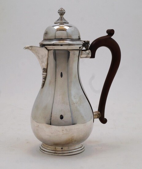 A silver coffee pot, Birmingham, 1935, Adie Brothers Ltd., the hinged lid with knopped finial, with composite handle, on stepped circular base, 23cm high, gross weight 19.2oz