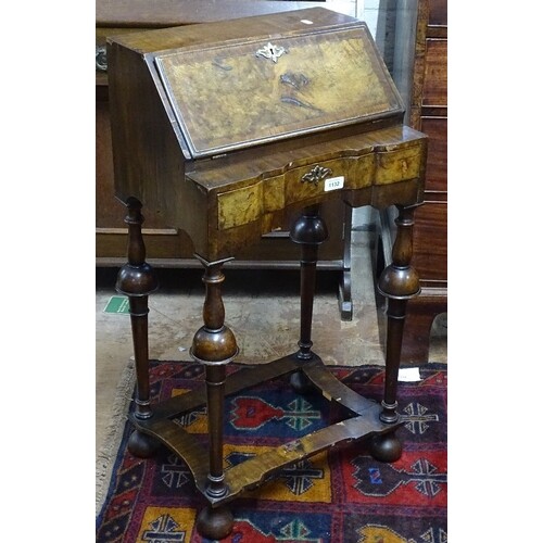 A small crossbanded walnut Queen Anne style bureau, with fit...