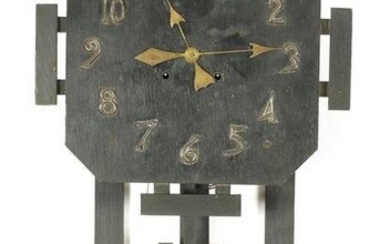 AN AMERICAN ARTS AND CRAFTS WALL CLOCK the ebonised oak