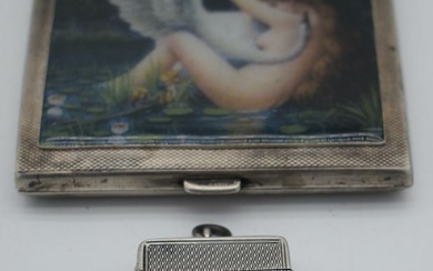 AN ANTIQUE SILVER VESTA CASE together with a silver cigarette case. Birmingham 1882 & 1932. 170 gram