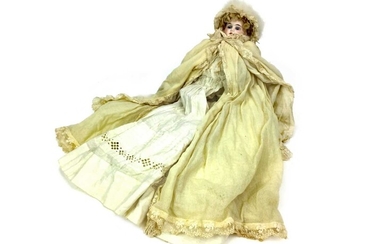 AN EARLY 20TH CENTURY GERMAN BISQUE HEADED DOLL