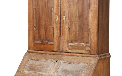 An 18th century oak bureau bureau, top with two doors, front with...