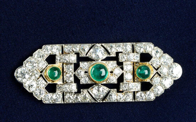 An Art Deco platinum and gold, emerald and diamond geometric brooch.