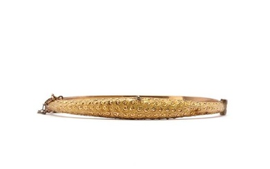 An Edwardian 9ct gold hollow hinged bangle
