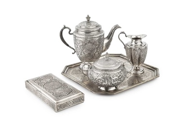 An Indo-Persian silver three piece tea service on tray, comprising...