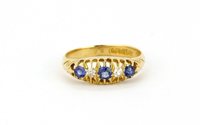 An antique hallmarked 18ct yellow gold ring set with diamonds and sapphires, (M.5).