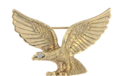 An eagle brooch, with colourless gem accent eye.