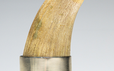 An early whale tooth in sterling silver stand (H:13.5cm) Condition...