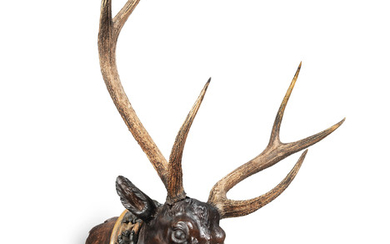An impressive late 19th/early 20th century carved and painted deer's head, German/Austrian