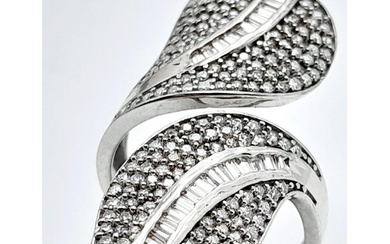 An incredibly attractive sterling silver and 14 K white gold...