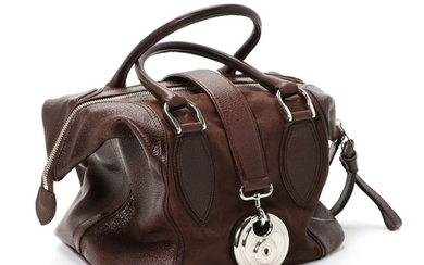 Balenciaga: A “Doctor Bag” made of brown leather, silver colored hardware, two handles and a compartment with a zipped pocket inside.