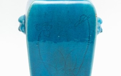 CHINESE BLUE GLAZE PORCELAIN VASE In squared form, with mask handles. Drilled. Height 10".