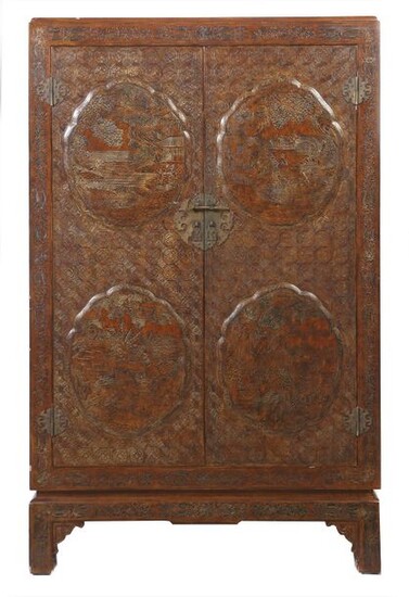 China cabinet, 20th century, wood/lacquer, high rectangular cabinet with double door front, inside a half high cabinet with double door, inside a shelf, all around decorated with relief decor, the front doors with 4 cartouches, in it landscape...