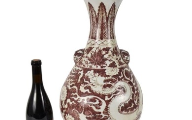 Chinese Red Underglaze Vase - A large pear-shaped stoneware ceramic vase with a flaring rim, atop a