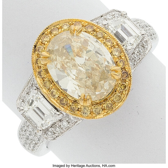 Colored Diamond, Diamond, Gold Ring Stones: Oval-shaped yellow diamond...