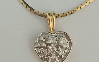 Heart pendant made of 14k yellow and white gold...