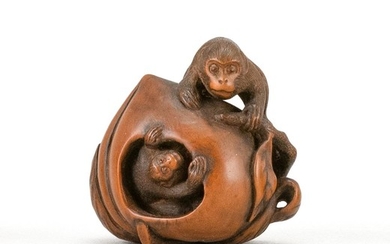 JAPANESE WOOD NETSUKE By Masachika. In the form of two monkeys climbing on a large peach. Signed. Height 1.5".