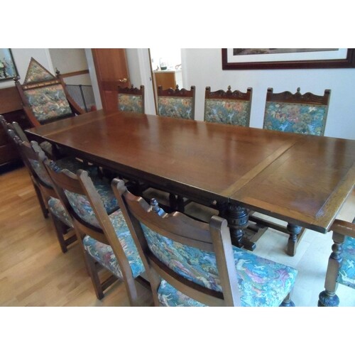 Large 20thC stained oak dining table with drop leaf ends tog...
