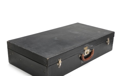 Louis Vuitton A black canvas motoring trunk with metal hardware, patinated full-grain...
