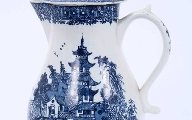 Lowestoft jug and cover, with a scrolled handle and a low domed cover, printed with a Chinese river cane below a printed cell border, 22.2cm high