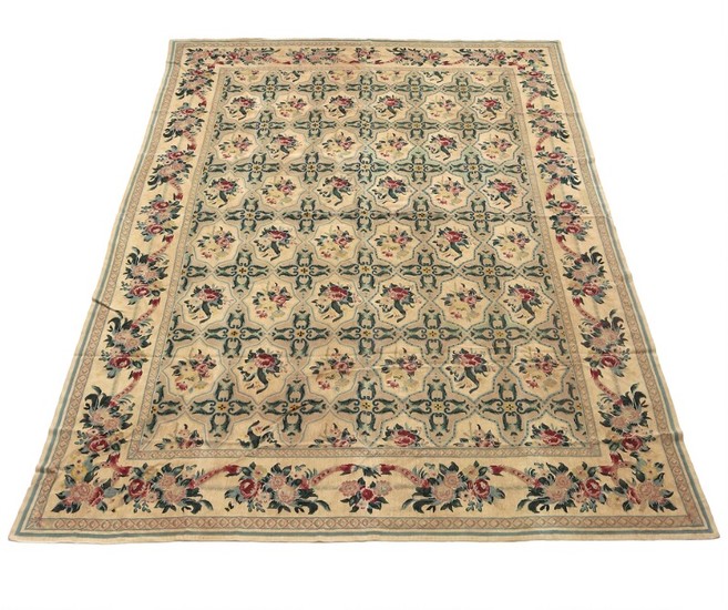 Needlepoint carpet, all-over design with flowers and foliage on light base. 20th century. 410×282 cm.