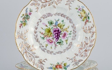 Royal Copenhagen, a set of four antique dinner plates with reticulated rim and leaf work.