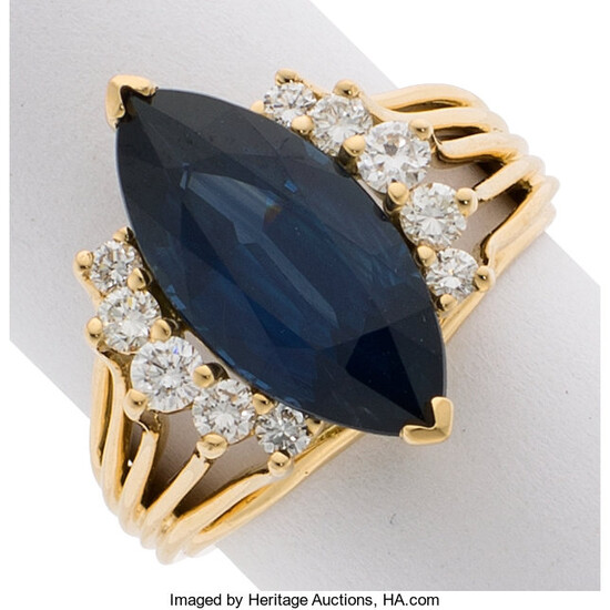 Sapphire, Diamond, Gold Ring The ring features a marquise-shaped...