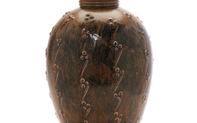 Saxbo: Stoneware vase modeled with budded pattern in relief. Decorated with brown glaze with dark elements. H. 33.