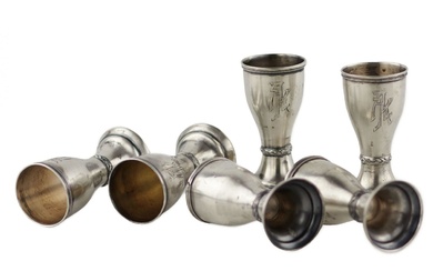 Set of six goblet-shaped, silver glasses with Art Deco elements....