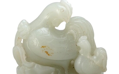 CELADON AND SLIGHT RUSSET-COLORED JADE CARVING OF A...