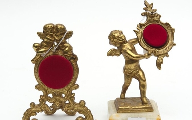 TWO SIMILAR ROCOCO STYLE GILT METAL POCKETWATCH STANDS, THE LARGEST 15 CM HIGH