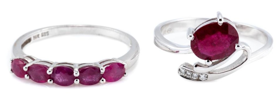 TWO WHITE GOLD RUBY RINGS; an 18ct with oval cut ruby and four small round brilliant cut diamonds, size M, wt. 2.06g, other 14ct set...