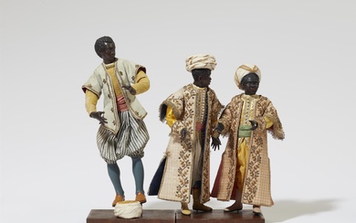 Three figures of young men from the retinue of King Balthasar from a Nativity scene