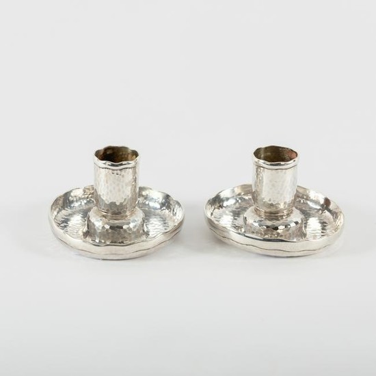 Tiffany & Co., a pair of planished silver candlesticks