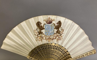 Two mid-19th century fans, the first with carved and pierced...