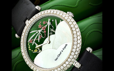 VAN CLEEF AND ARPELS. A LADY’S UNIQUE AND ELEGANT 18K WHITE GOLD AND DIAMOND-SET WRISTWATCH WITH DATE AND MONTH INDICATOR, ENAMEL WITH FAIRY MOTIFS AND MOTHER-OF-PEARL DIAL REF. HH 17194