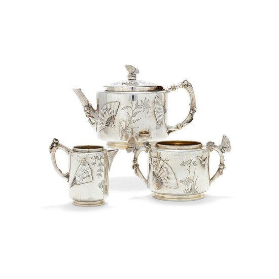 ? An Aesthetic Movement silver small three piece tea service by Elkington & Co.