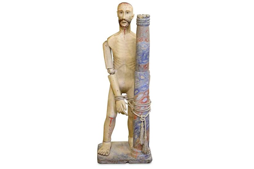 A 19TH CENTURY CARVED WOOD AND POLYCHROME DECORATED FIGURE...