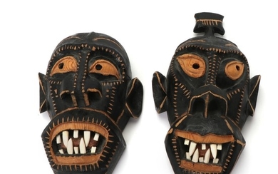 Two Greenlandic cared and painted wood masks. (2)