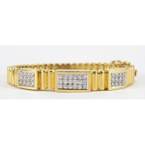 18ct gold diamond cluster hinged bangle, set with forty two ...