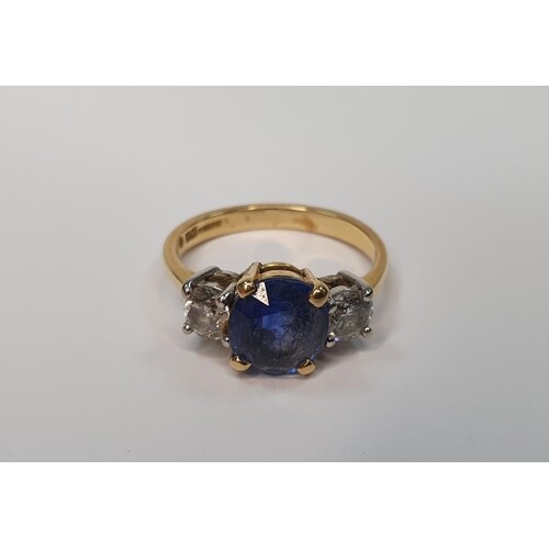 18ct yellow gold ring set with a central Sapphire (approx 2....