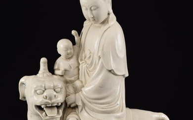 18th/19th century large impressive Chinese white glazed Guan Yin and child riding a mythical beast.