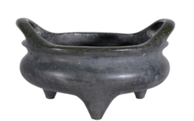 A Chinese bronze two-handled censer, supported on three