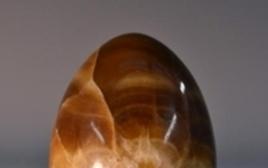 A 19th century fluorspar egg shaped paperweight, turned