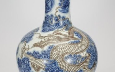 CHINESE BLUE AND WHITE IRON RED DRAGON BOTTLE VASE
