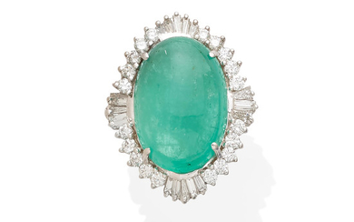 An emerald cabochon and diamond ring