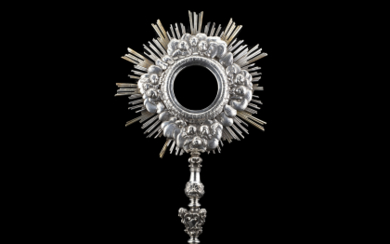 A silver monstrance. Macerata, first half of the 18th Century. Silversmith Dionisio Boemer (h. cm 58) (g gross 1675 ca.)...