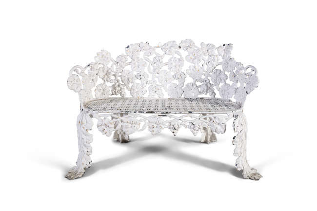A VICTORIAN CAST IRON GARDEN BENCH, formed by...