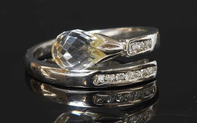 A 14ct white gold rock crystal and diamond crossover ring