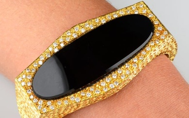 A 1970s 18ct gold onyx and pavÃ©-set diamond textured, hinged bangle, by Pablo.Estimated total